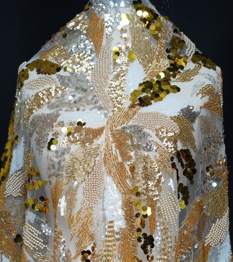 Gold embroidered fabric on the table
